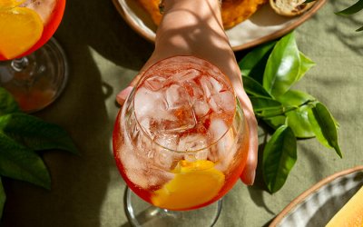 hand-holding-italian-cocktail-still-life.jpg